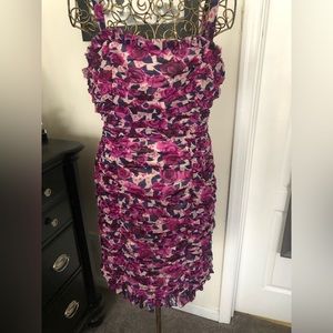 Cute dress with ruching throughout. Great for date night or an evening out.